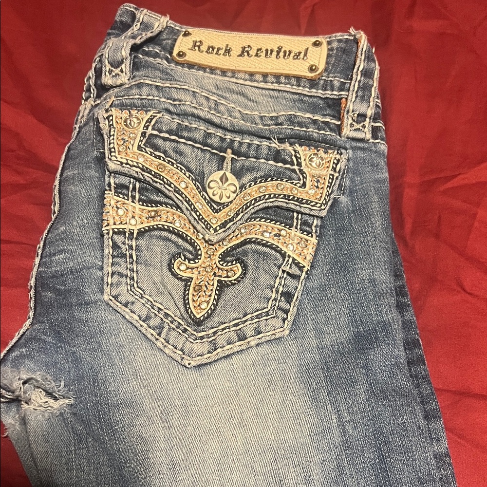 Rock Revival Distressed Blue Jeans with Gold Accents